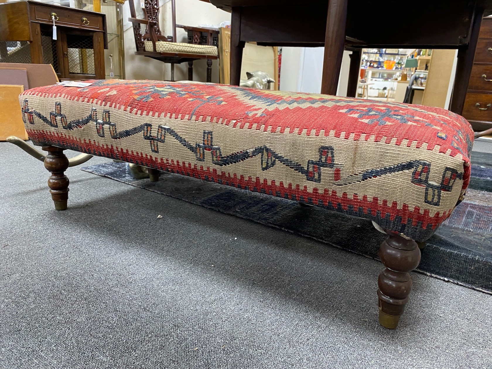 A Kelim covered long foot stool, length 108cm, depth 50cm, height 35cm